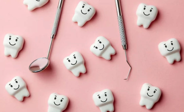 dental tools and smiling tooth models