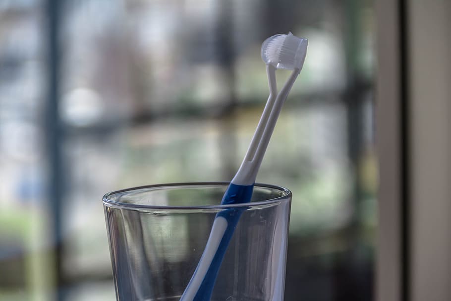 a toothbrush in a glass